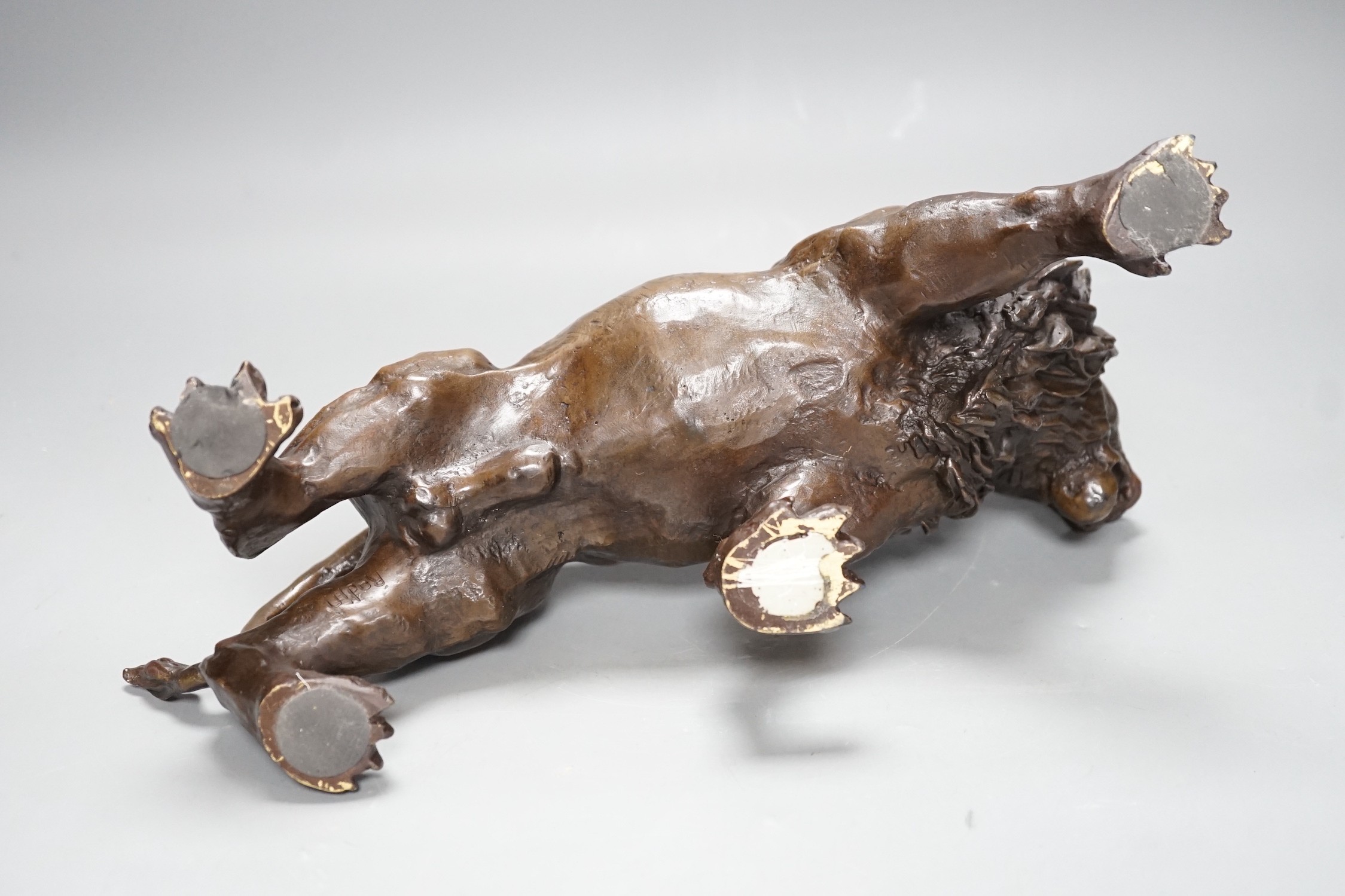 A 20th century bronze figure of a lion, 30cm long